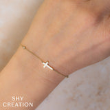 0.03CT DIAMOND BEZEL CROSS BRACELET