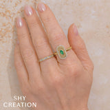 0.20CT DIAMOND & 0.21CT EMERALD OVAL RING